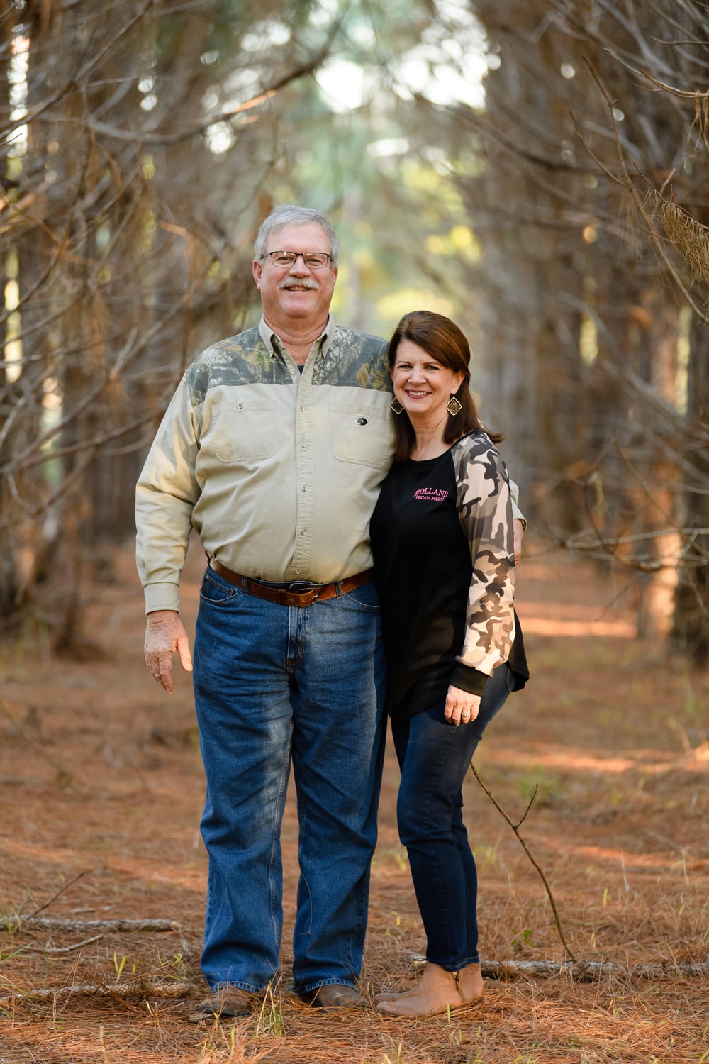 Woody and Melody Holland in their pecan orchard